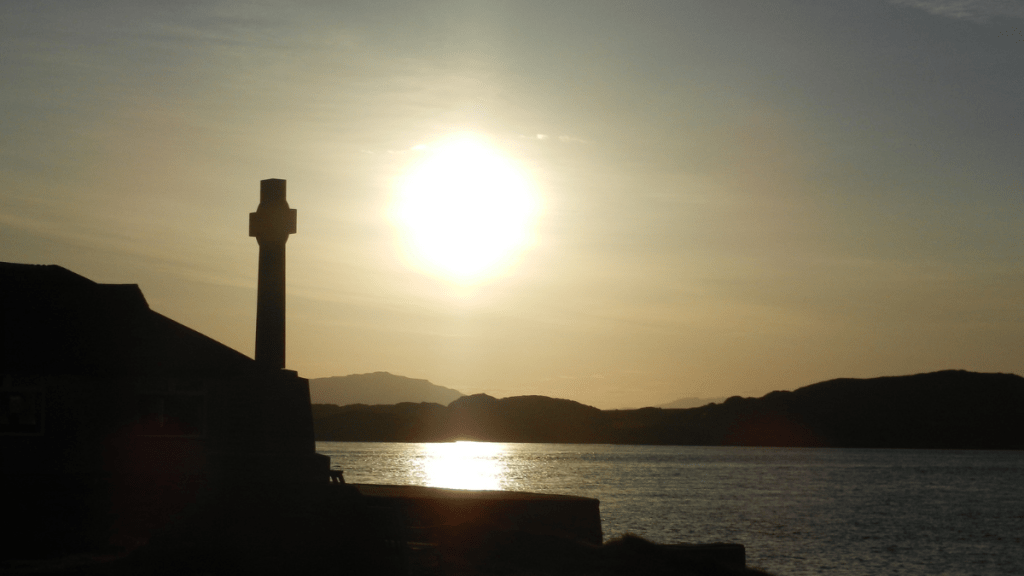 I recently spent a week on Iona island in Scotland where I found myself living and witnessing a very powerful Divine demonstration. The island’s guardian is Columba, a very special being. On the first evening of my arrival, a friend of mine who I travelled with and had been to the island many times before, took me on a bit of a tour. We ended up at the abbey. We stopped at a small room attached to the Abbey (photo below, small door shown to the left of the cross) and went inside.